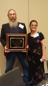 Pictured are Bryant, left, and Bonnie Statzer, Bryant’s longtime girlfriend, who was present to help congratulate him on this accomplishment. Dale Bennett, president of VTA, and Joby Webb, CIC of Nansemond Insurance, presented the award.