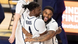 basketball teammates hugging